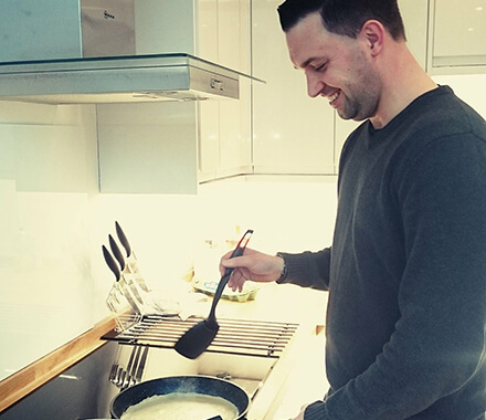 Jon making pancakes in the Avius kitchen