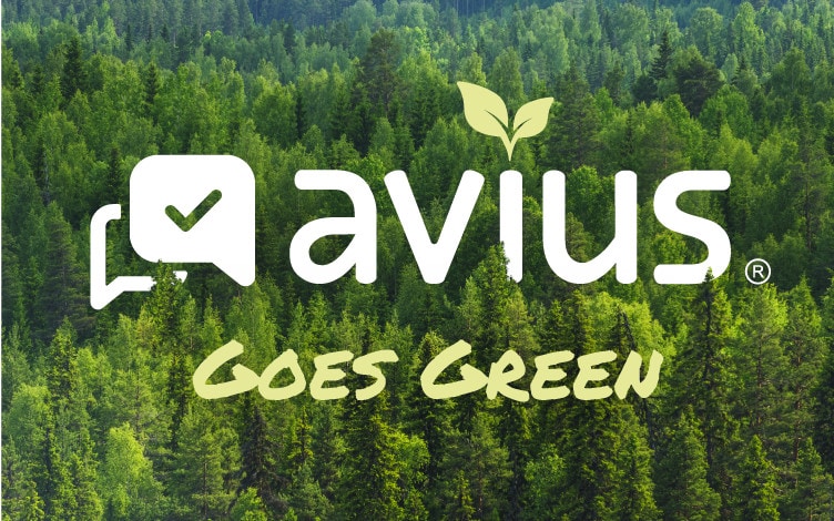 Avius Goes Green sign with forest in the background